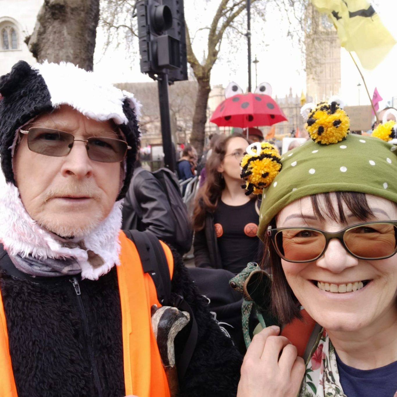 Picture of David dressed as a badger with Hazel dressed as a bee at The Big One march in 2023